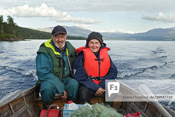 Senior couple on fishing boat