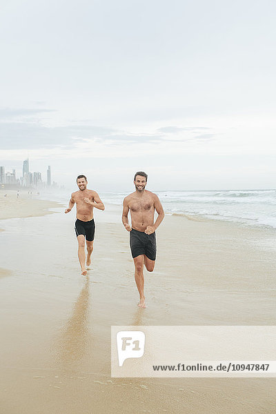 Men running on beach