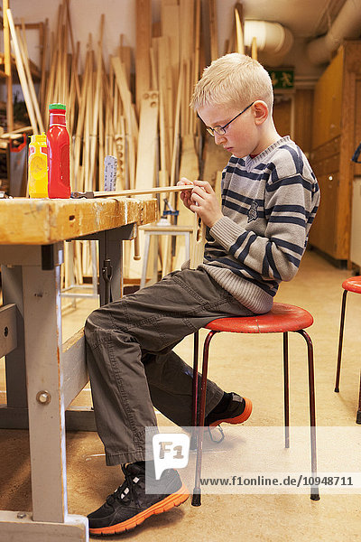 Boy in school workshop