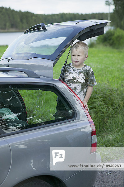 Boy in boot looking away
