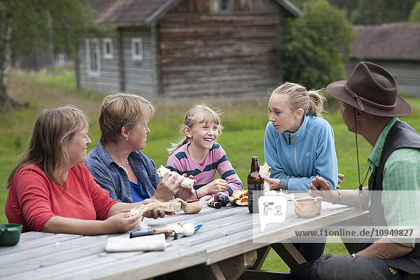 Family with two girls having picnic