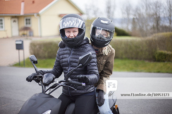 Teenage girls on scooter