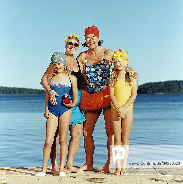 Women with girls at water