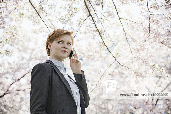 Young woman talking via cell phone