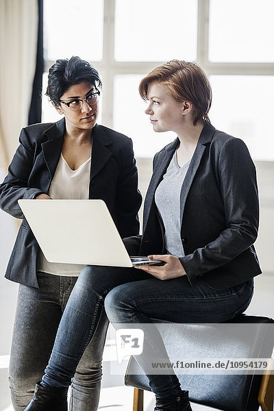 Businesswomen using laptop
