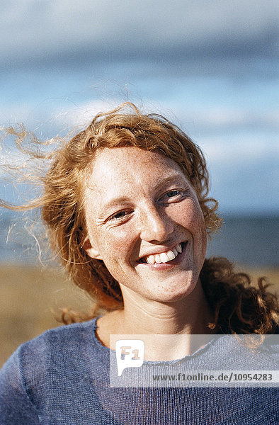 Portrait of smiling redhead woman