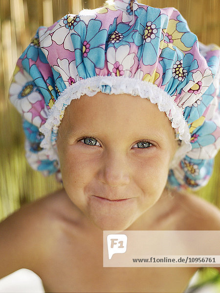 A child wearing a bathing cap  Sweden.