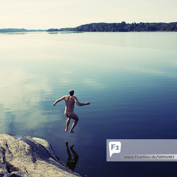 A man jumping into the water  Sweden.