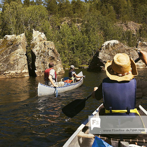 A family canoeing  Sweden.
