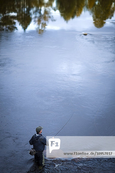 A man fly-fishing  Sweden.