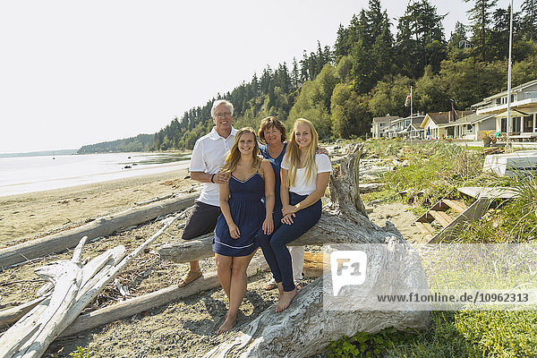 'Portrait of a family on the beach; Whidbey Island  Washington  United States of America'