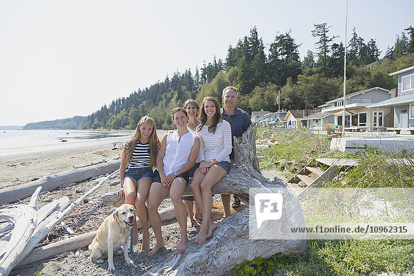'Portrait of a family on the beach; Whidbey Island  Washington  United States of America'