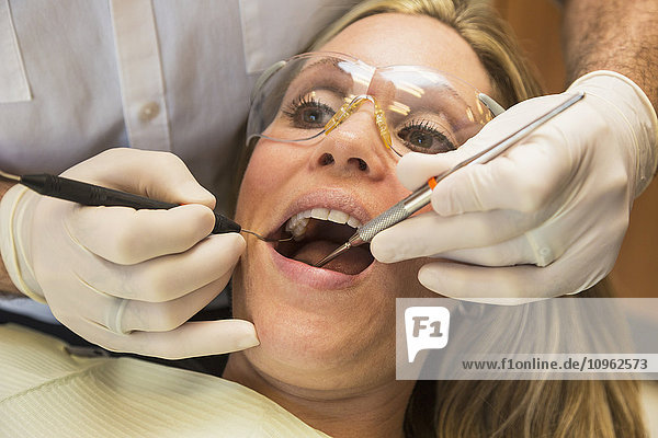 'Female patient at dental appointment; Edmonton  Alberta  Canada'