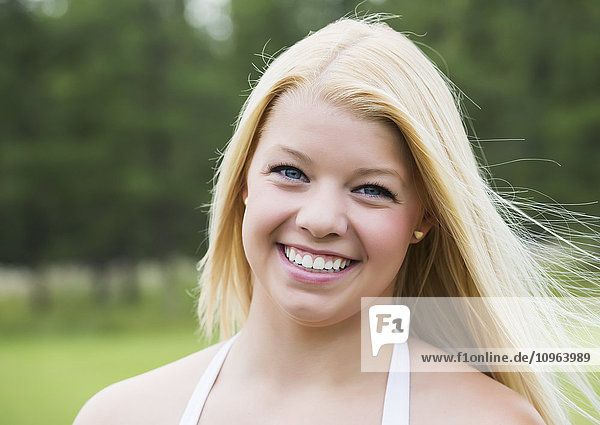 'Portrait of a teenage girl with long blond hair; Edmonton  Alberta  Canada'