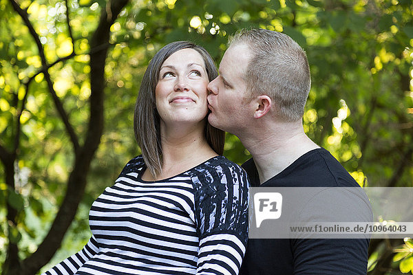 'Portrait of a couple expecting a baby; Langley  British Columbia  Canada'