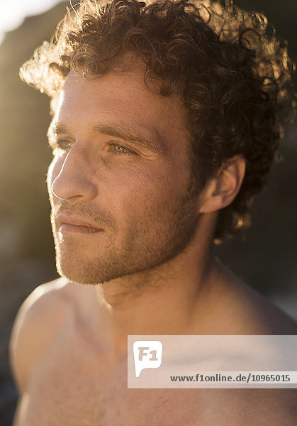 'Portrait of a shirtless man with curly hair; Tarifa  Cadiz  Andalusia  Spain'