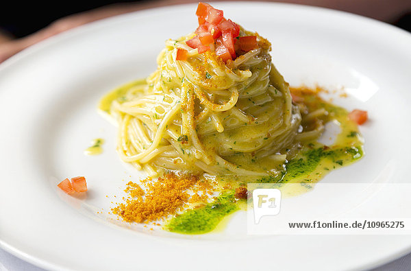 'Fresh authentic Italian pasta with lemon butter sauce nicely plated for dinner at a restaurant in Italy; Bellagio  Lombardy  Italy'