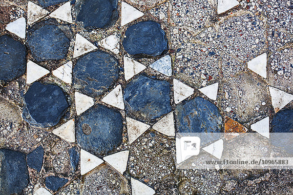 'Broken tile in the shape of stars on the ground; Philippi  Greece'