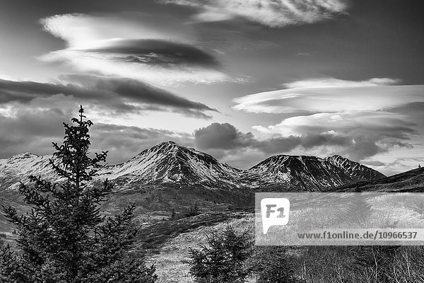 Black and white photo of lenticular clouds over the Three Sisters mountains  Kodiak Island  Southwest Alaska