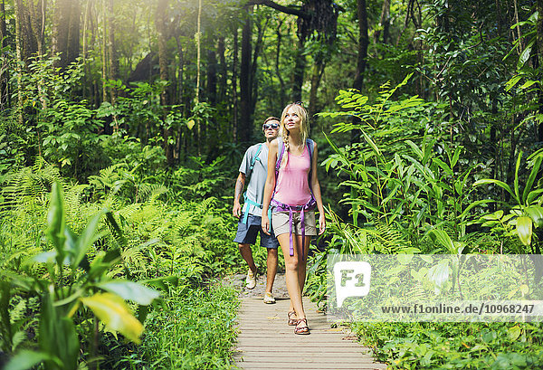Attractive young couple having fun together outdoors on hike