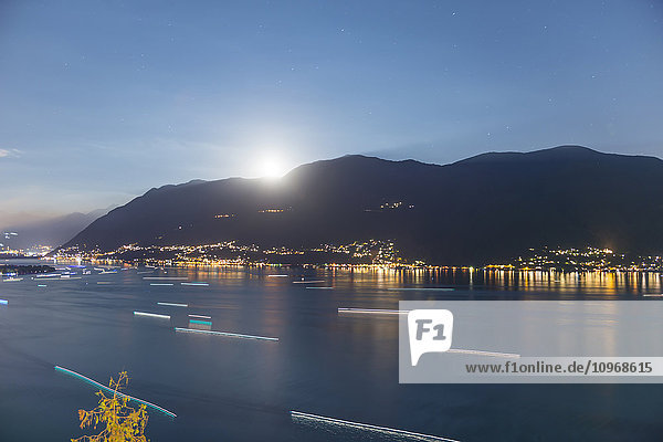 'Moonlight shining over the swiss alps and Lake Maggiore; Ascona  Ticino  Switzerland'
