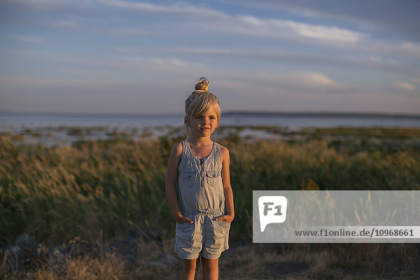 'Portrait of a young girl on a beach at sunset; Surrey  British Columbia  Canada'