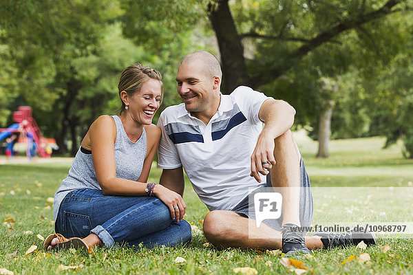'A married couple spending quality time together in a park; Edmonton  Alberta  Canada'