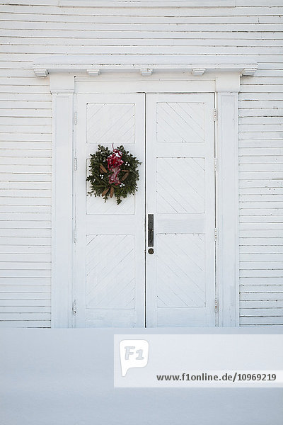 'Christmas wreath on front door of church; Hatley  Quebec  Canada'