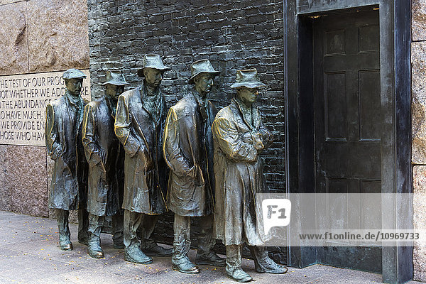 'Bronze statue depicting people waiting on a bread line during the Great Depression  Franklin Delano Roosevelt Memorial; Washington  District of Columbia  United States of America'