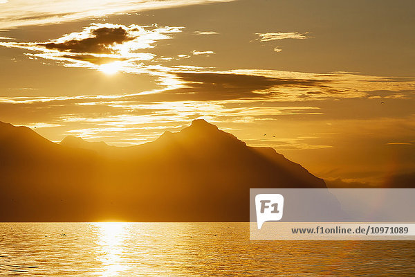 'Sunset On A Mountainous Ridgeline Of The Alaska Peninsula Near The Start Of The Aleutian Islands; Southwest Alaska  United States Of America'
