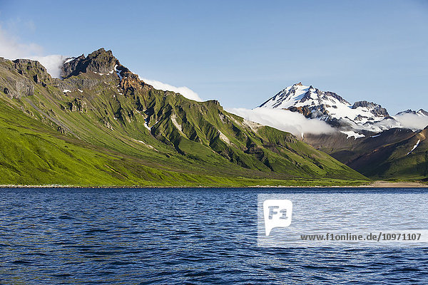 'Frosty Volcano Near Cold Bay On The Alaska Peninsula In Summertime; Southwest Alaska  United States Of America'