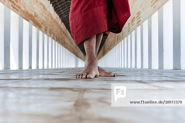 'Bare feet of a buddhist monk in the corridor of the temple; Bagan  Myanmar'