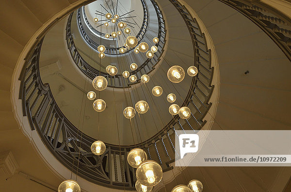 'Spiral staircase with lights at Heal's department store  Tottenham Court Road; London  England'