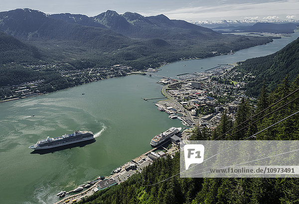 Scenic view from Mt. Roberts tram of Gastineau Channel  Douglas Island and Juneau as a Princess Cruises cruise ship departs.