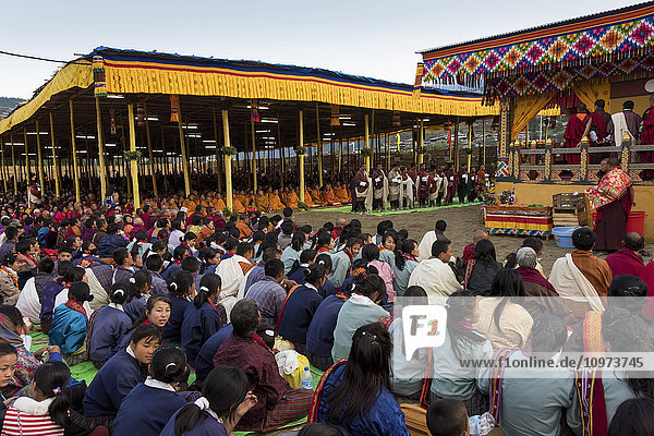 'Monks and worshipers; Paro  Bhutan'