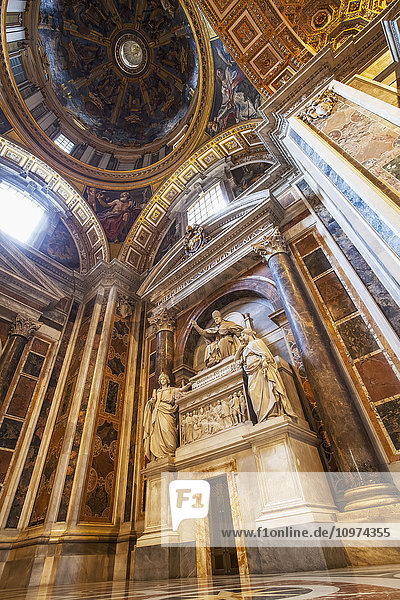 'Dome ceiling and ornate facade  St. Peter's Basilica; Rome  Italy'