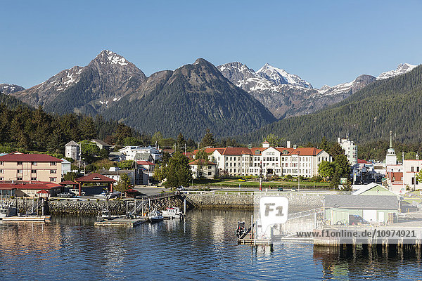 The Pier at the Sitka Harbor with downtown Sitka and the Sisters mountains in the background  Southeast Alaska  USA  Summer