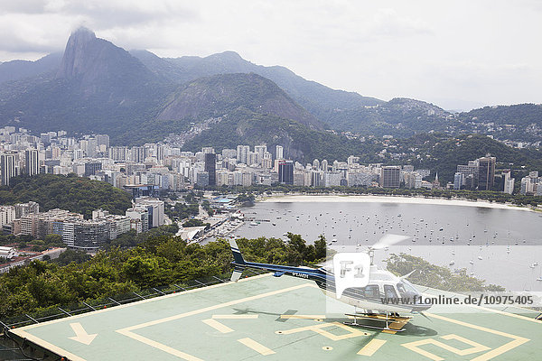 'Sightseeing helicopter at top of Sugarloaf Mountain  looking to Botafogo Bay; Rio de Janeiro  Brazil'