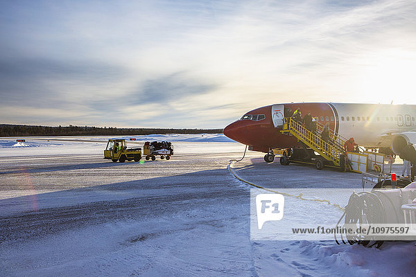 'A plane lands at Kiruna airport during winter; Kiruna  Sweden'