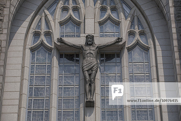 'Crucifix on exterior of Saint-Michel Basilica-Cathedral; Sherbrooke  Quebec  Canada'