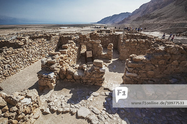 'Tourists at the site of ancient ruins; Qumran  Israel'