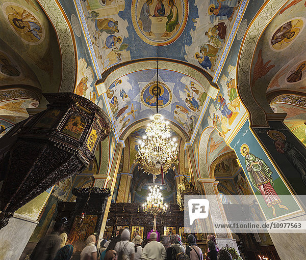 'Tourists inside the colourful St. Gabriel Church; Nazareth  Israel'