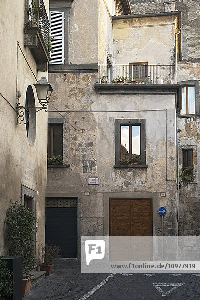 'Wooden double doors on a residential building; Orvieto  Umbria  Italy'