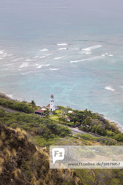 'View of Diamond Head Lighthouse with waves breaking in the shallow water in background; Honolulu  Oahu  Hawaii  United States of America'