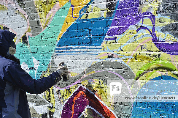 'Graffiti writer at Westbourne Grove; London  England'