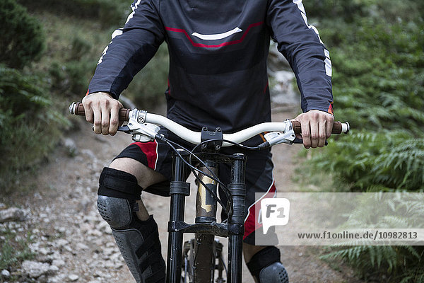 Mountainbiker on forest path