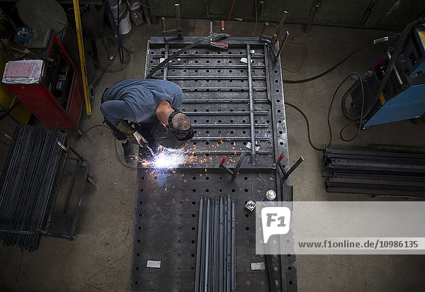 Metal construction  welder welding railing