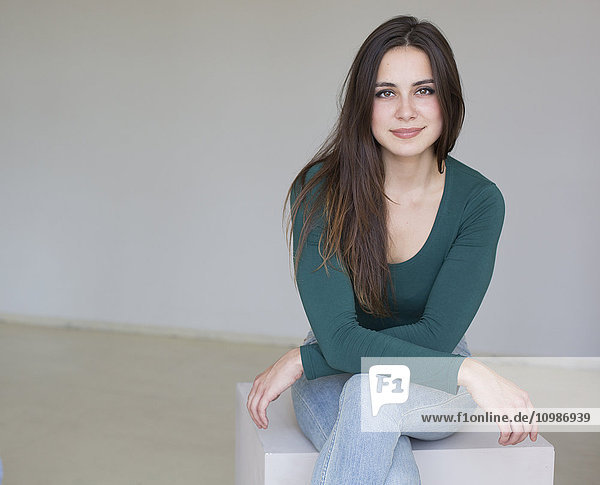 Portrait of smiling brunette young woman