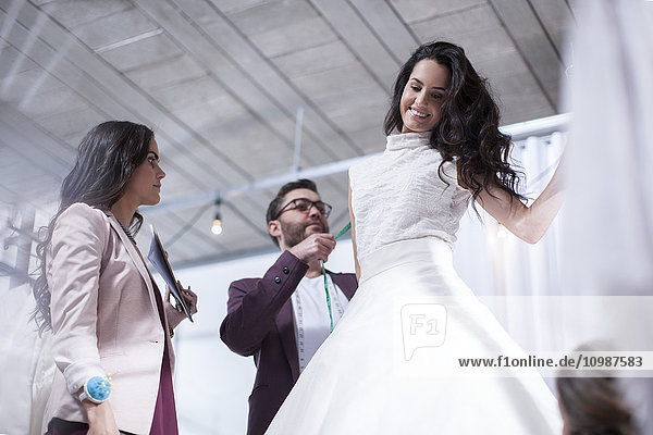 Woman trying on wedding dress