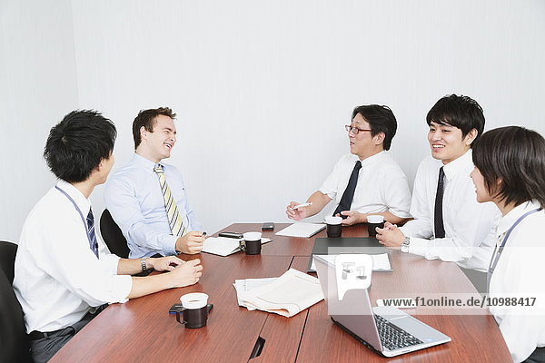 Multi-ethnic business people in a meeting room